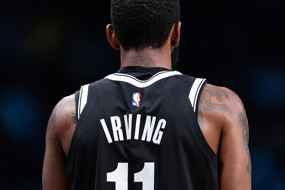 NEW YORK, NEW YORK - NOVEMBER 01: Kyrie Irving #11 of the Brooklyn Nets looks on during a break in the action during the first quarter of the game of the Chicago Bulls at Barclays Center on November 01, 2022 in New York City. NOTE TO USER: User expressly acknowledges and agrees that, by downloading and or using this photograph, User is consenting to the terms and conditions of the Getty Images License Agreement. (Photo by Dustin Satloff/Getty Images)