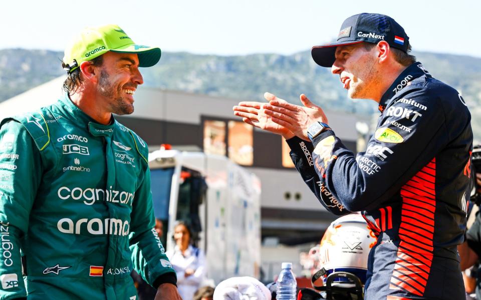 Pole position qualifier Max Verstappen of the Netherlands and Oracle Red Bull Racing and Second placed qualifier Fernando Alonso of Spain and Aston Martin F1 Team talk in parc ferme during qualifying ahead of the F1 Grand Prix of Monaco at Circuit de Monaco on May 27, 2023 in Monte-Carlo, Monaco - Mark Thompson/Getty Images