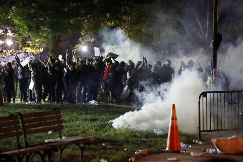 Tear gas billows as demonstrators gather in Lafayette Park to protest the death of George Floyd, Sunday, May 31, 2020, near the White House in Washington. (Photo: ASSOCIATED PRESS /Alex Brandon)