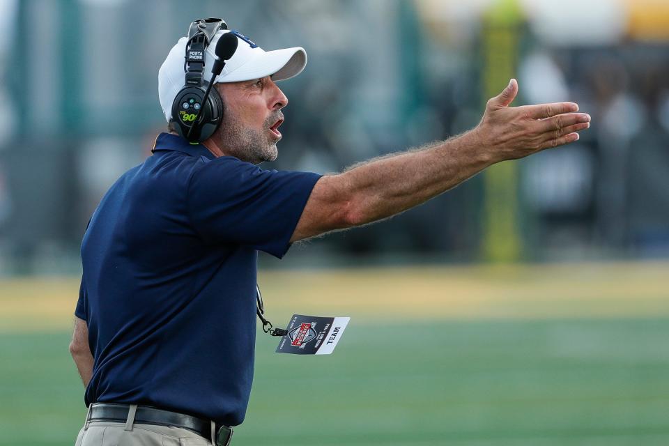 Dearborn Fordson head coach Fouad Zaban reacts to a play against Canton during the first half of the Prep Kickoff Classic at Tom Adams Field in Detroit, Thursday, Aug. 26, 2021.