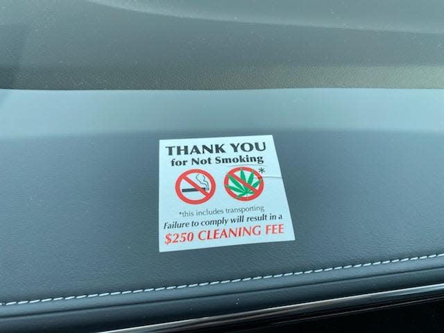 A reminder on the dashboard of a loaner car at Sellers Buick GMC in Farmington Hills to not smoke cigarettes or marijuana inside the vehicle.