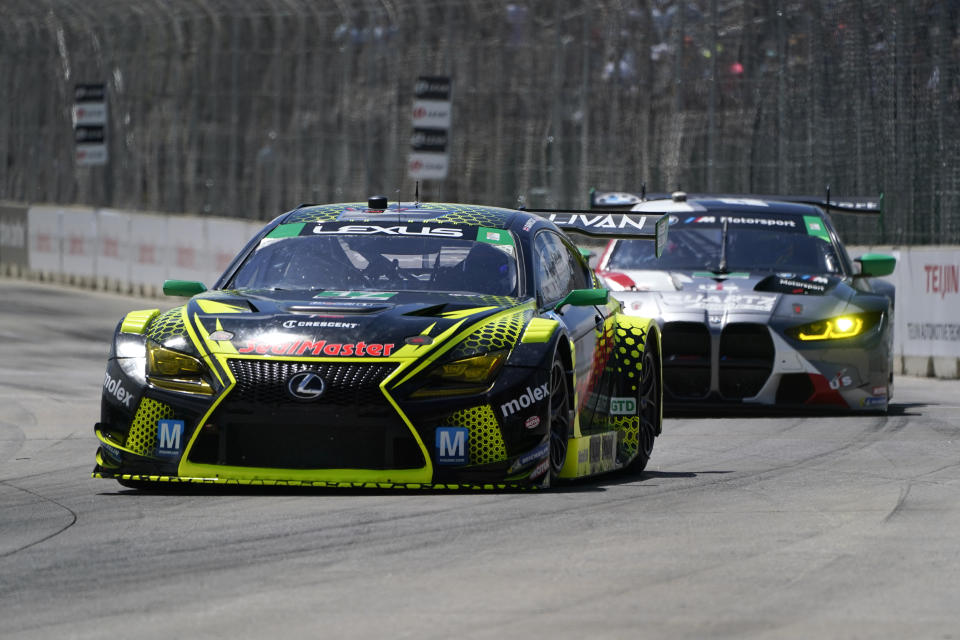 Ben Barnicoat drives his GT3 class car during the IMSA Sports Cars Championship auto race on Belle Isle in Detroit, Saturday, June 4, 2022. (AP Photo/Paul Sancya)