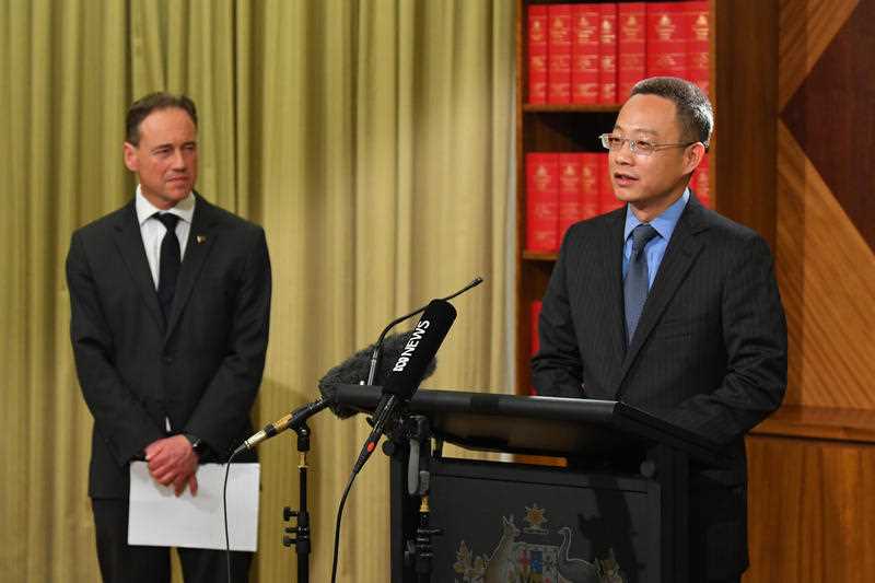 Victoria and Tasmania Consul-General of China Long Zhou (right) and Health Minister Greg Hunt during a press conference at the Commonwealth Parliamentary Offices in Melbourne.