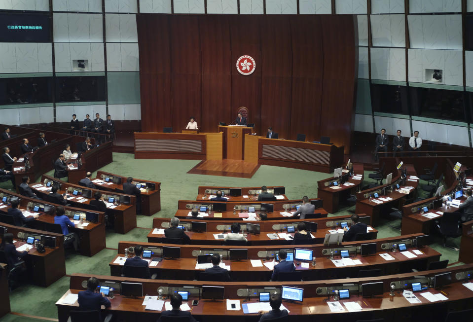 Hong Kong Chief Executive Carrie Lam delivers her policy speech at the Legislative Council in Hong Kong Wednesday, Oct. 10, 2018. Lam has unveiled a major reclamation project called "Lantau Tomorrow Vision," under which about 1,700 hectares will be developed to provide homes for 1.1 million people, according to government radio. (AP Photo/Vincent Yu)