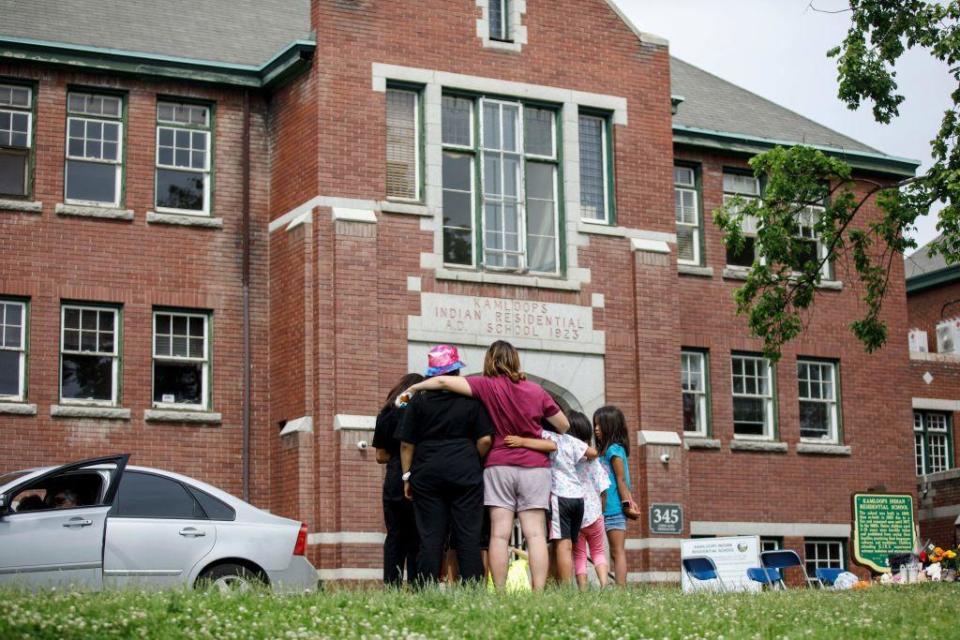 The former Kamloops Indian Residential School where a makeshift memorial honored 215 children whose remains were discovered buried nearby in  Kamloops, British Columbia, Canada, on June 3, 2021. / Credit: COLE BURSTON/AFP via Getty