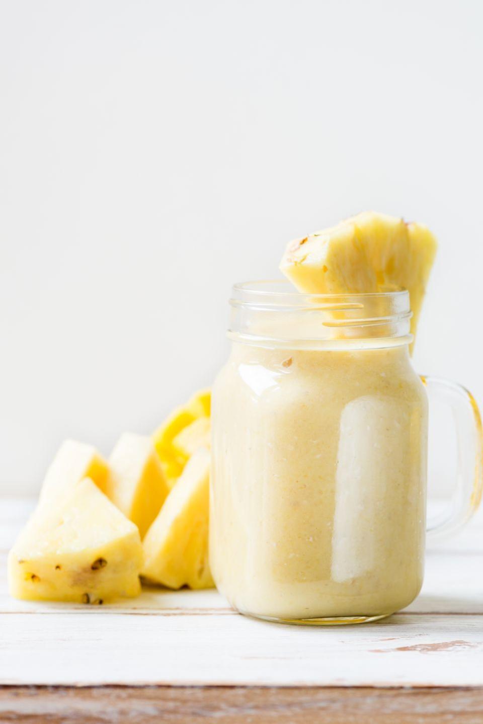mediterranean diet mango, banana, pineapple and oatmeal smoothie in the jar
