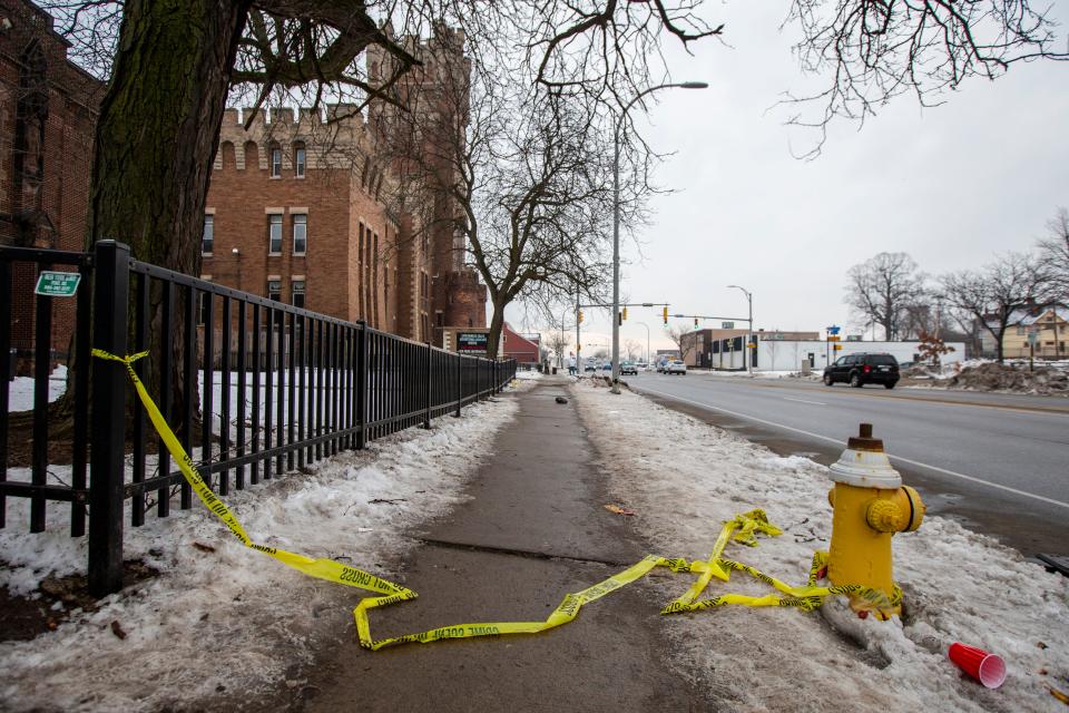 Police tape remains on the ground outside of the Main Street Armory on Monday, March 6, 2023, in Rochester, N.Y. (AP Photo/Lauren Petracca)