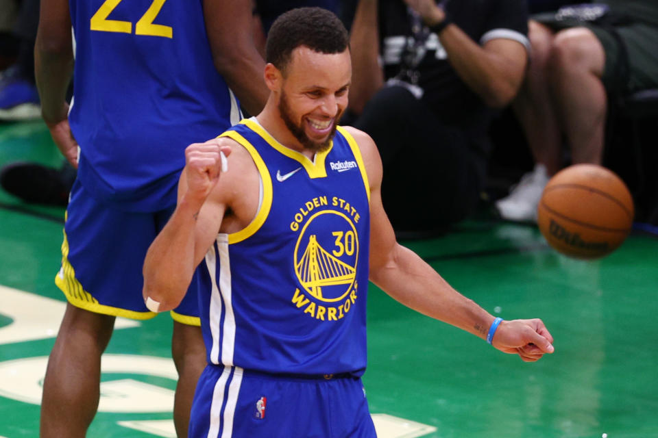 Golden State Warriors star Stephen Curry celebrates against the Boston Celtics during Game 6 of the 2022 NBA Finals at TD Garden in Boston on June 16, 2022. The Warriors won the 2022 NBA championship. (Elsa/Getty Images)