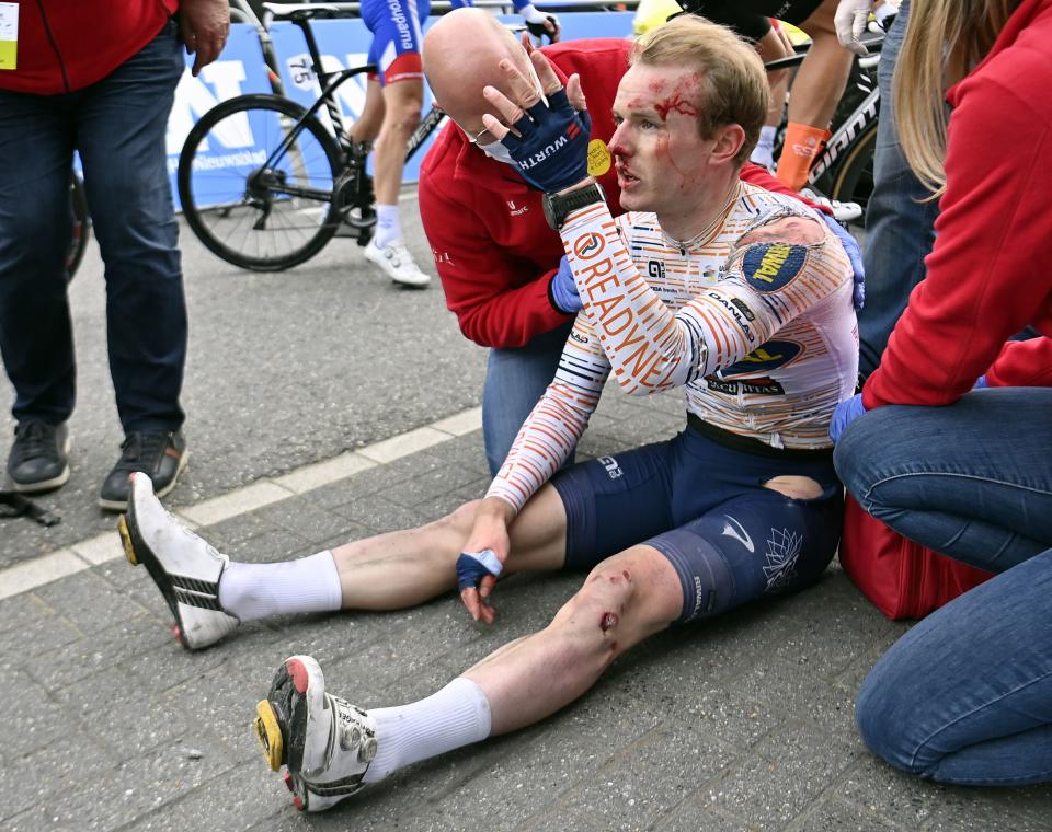 Norwegian rider August Jensen reacts after a crash (Belga/AFP via Getty Images)