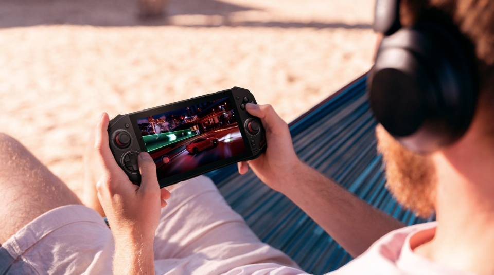 A dude on the beach playing games.