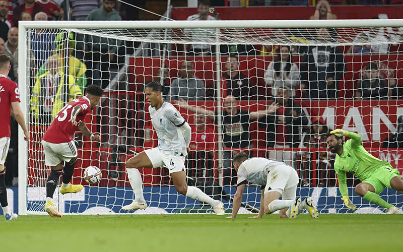 Manchester United's Jadon Sancho scores his side's first goal