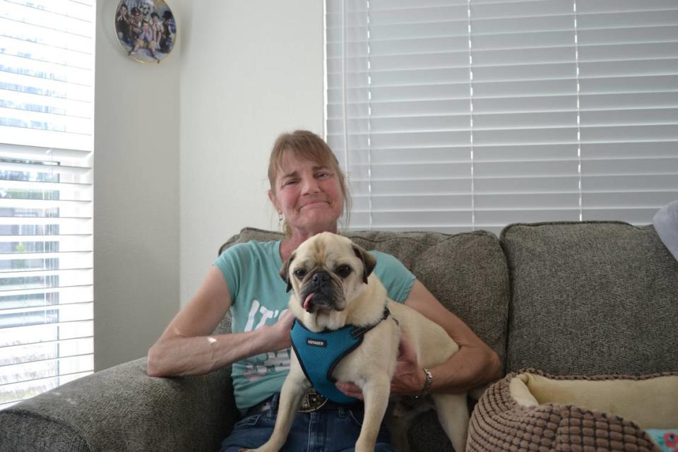 Christy Nair and her pug, Duke, have lived at Silver City West mobile home park for about 11 years. Nair’s first home was protected by rent control, but when she moved to a new unit, she lost her rent control protections.