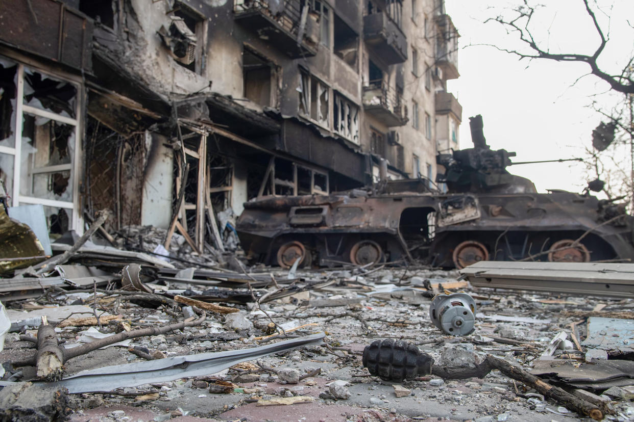 MARIUPOL, UKRAINE - 2022/03/23: A grenade and destroyed BTR armoured vehicle likely belonging to Azov Battalion defenders lies next to a destroyed apartment complex. The battle between Russian / Pro Russian forces and the defencing Ukrainian forces lead by Azov battalion continues in the port city of Mariupol. (Photo by Maximilian Clarke/SOPA Images/LightRocket via Getty Images)