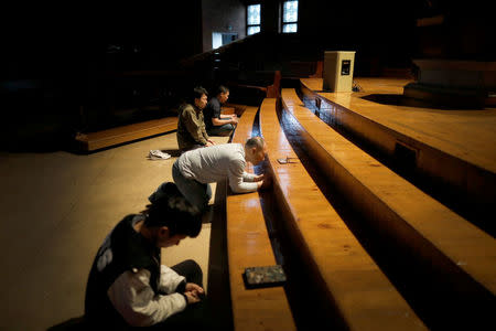 Students pray during an early-morning prayer session at the Presbyterian University and Theological Seminary (PUTS) in Seoul, South Korea, September 12, 2017. Picture taken on September 12, 2017. REUTERS/Kim Hong-Ji