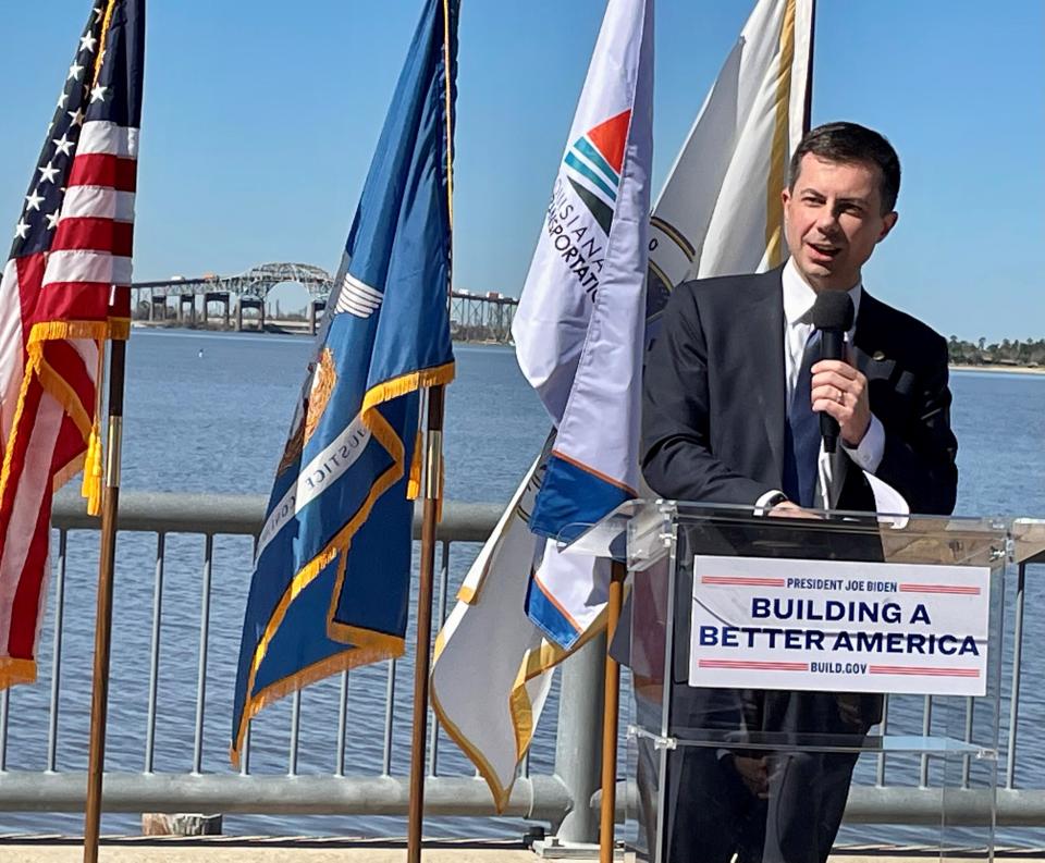 U.S. Transportation Secretary Pete Buttigieg celebrates a $150 million grant to build a new bridge on Interstate 10 in Lake Charles on Feb. 9, 2023.