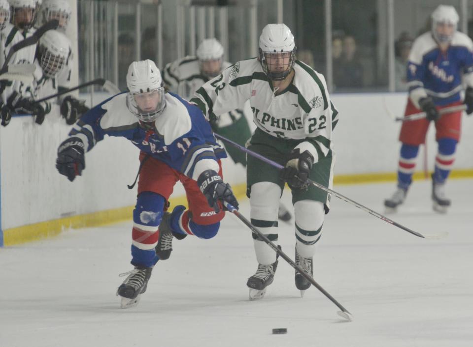 Ashland's Jake Keaveny moves the puck down the ice followed by D-Y's Max Hulten in second period action on March 5th.