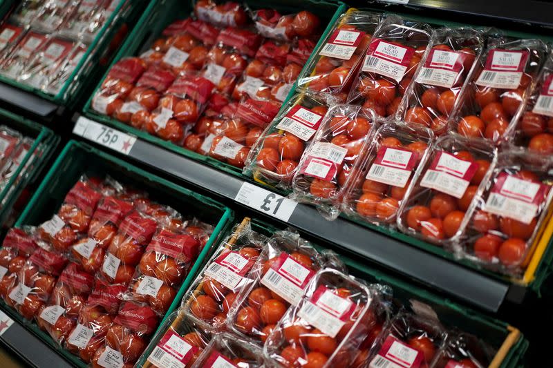 FILE PHOTO: Tomatoes are displayed for sale inside a supermarket in London