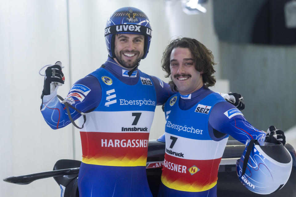 INNSBRUCK, AUSTRIA - DECEMBER 18: Chris Mazdzer with Jayson Terdiman of the USA pose for a picture after crossing the finish line of the Men's Doubles race during the FIL Luge World Cup at Olympia-Eiskanal Iglis on December 18, 2021 in Innsbruck, Austria. (Photo by Jan Hetfleisch/Getty Images)