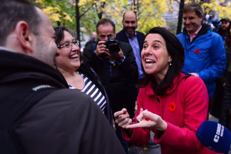 Valérie Plante, right, speaks with voters in Montreal. Photo from CP.