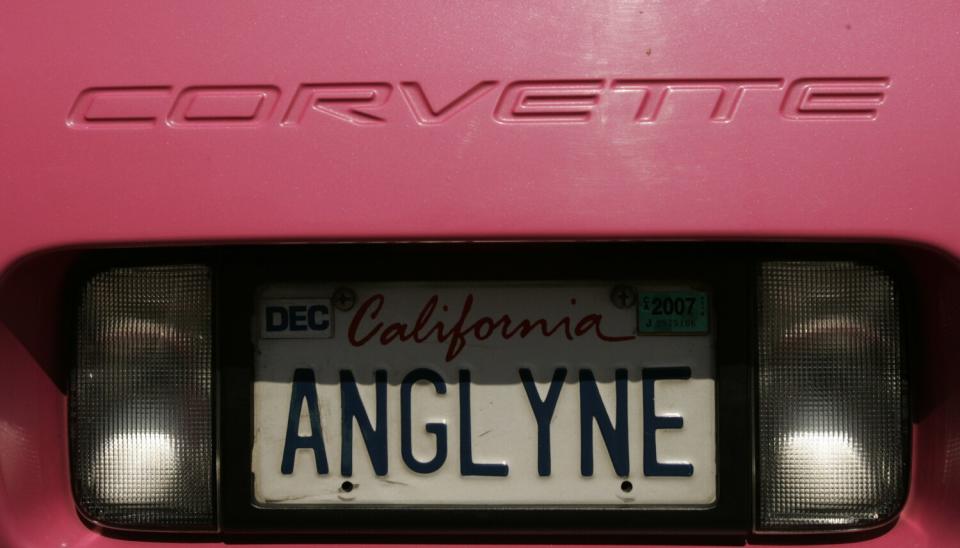 The back of a pink Corvette with a California license plate reading ANGLYNE.