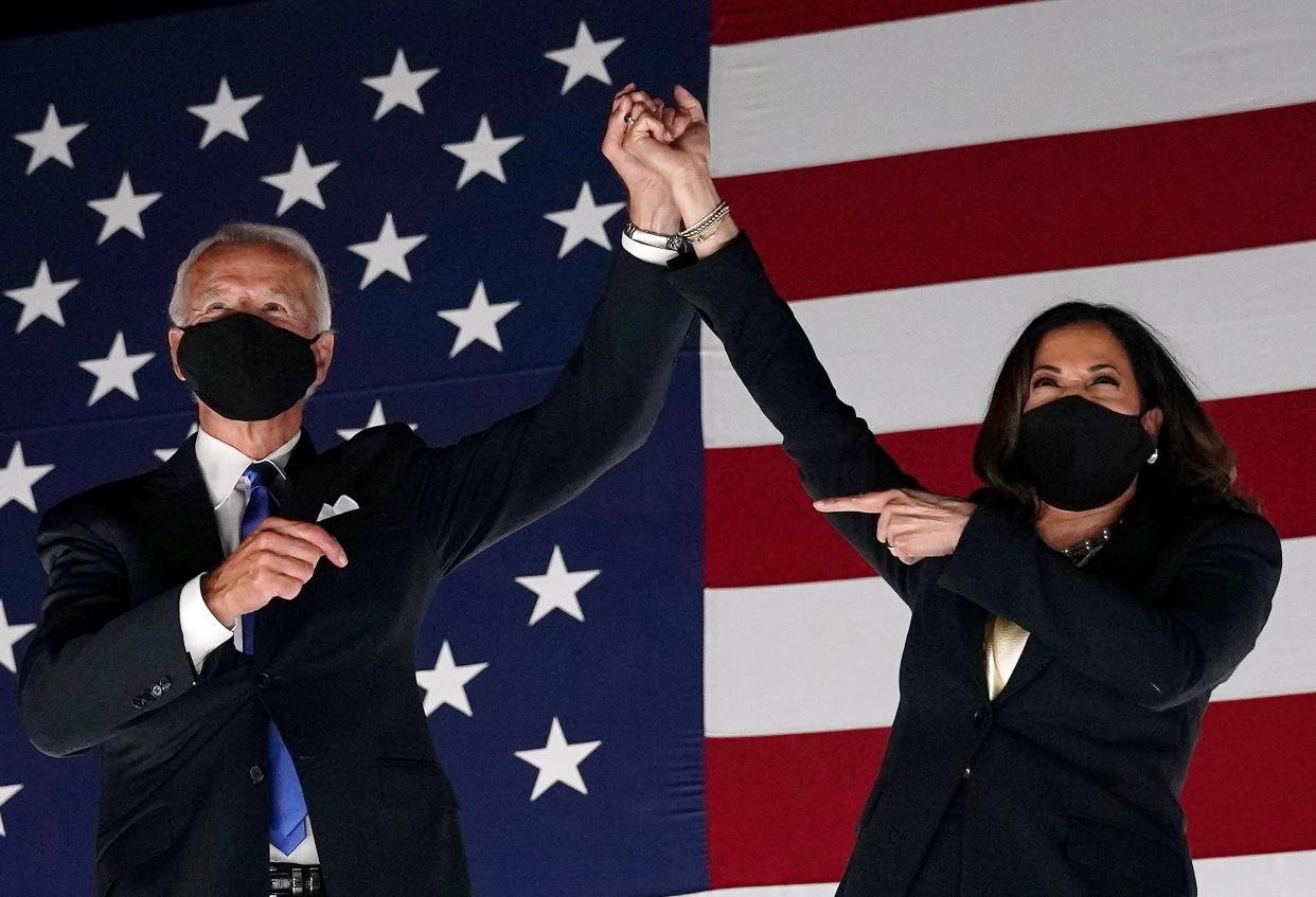 Former vice-president and Democratic presidential nominee Joe Biden (L) and Senator from California and Democratic vice presidential nominee Kamala Harris greet supporters outside the Chase Center in Wilmington, Delaware, at the conclusion of the Democratic National Convention, held virtually amid the novel coronavirus pandemic, on August 20, 2020. (Olivier Douliery/AFP via Getty Images)