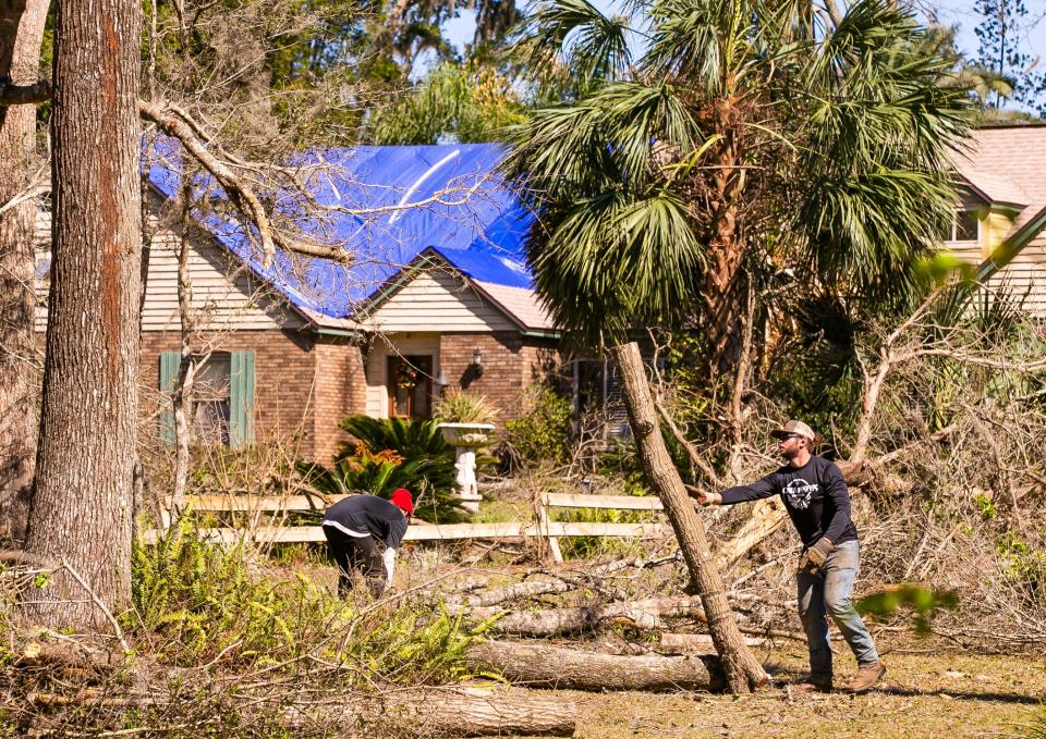 Crews were working Sunday at El Dorado, a subdivision off Southwest 24th Avenue that was in the tornado's path on Saturday.