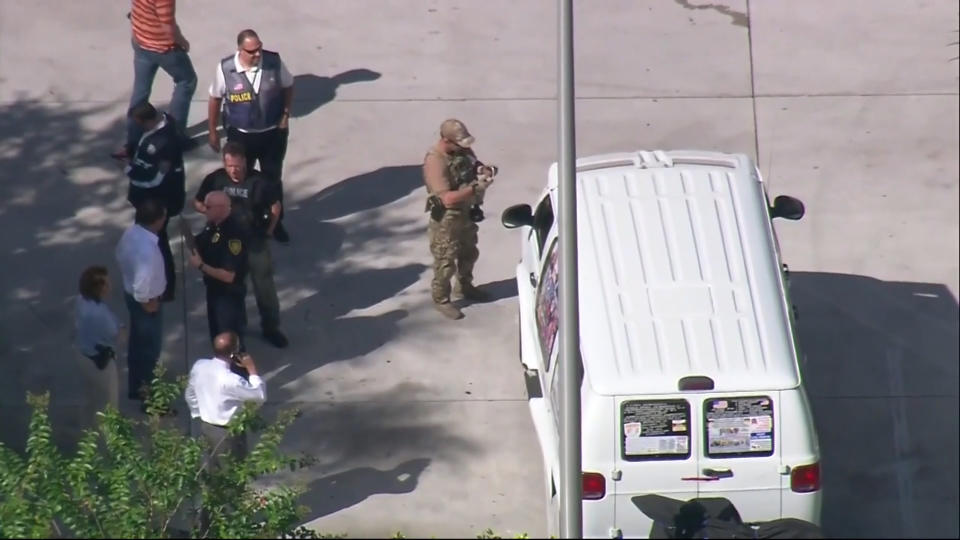 Authorities are seen Plantation, Florida taking a man into custody suspected of being connected to the series of mailed packaged bombs.