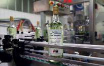 A bottle of pear and mint alcohol is pictured at Swiss distiller Morand in Martigny