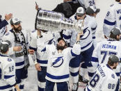 Tampa Bay Lightning's Nikita Kucherov (86) hoists the Stanley Cup after defeating the Dallas Stars in the NHL Stanley Cup hockey finals, in Edmonton, Alberta, on Monday, Sept. 28, 2020. (Jason Franson/The Canadian Press via AP)