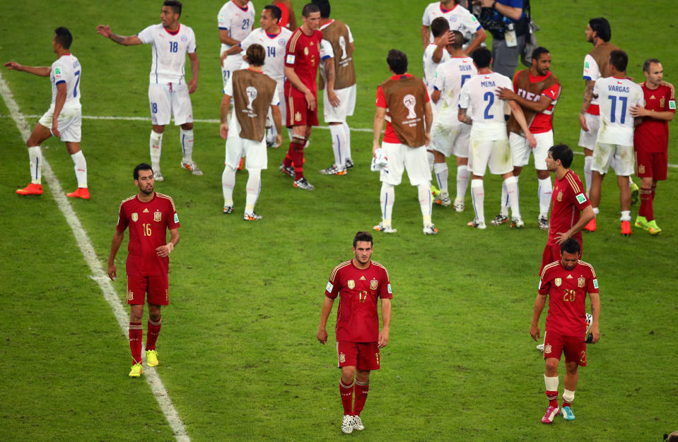 Spain’s players trudge off after exiting the last World Cup at the group stages