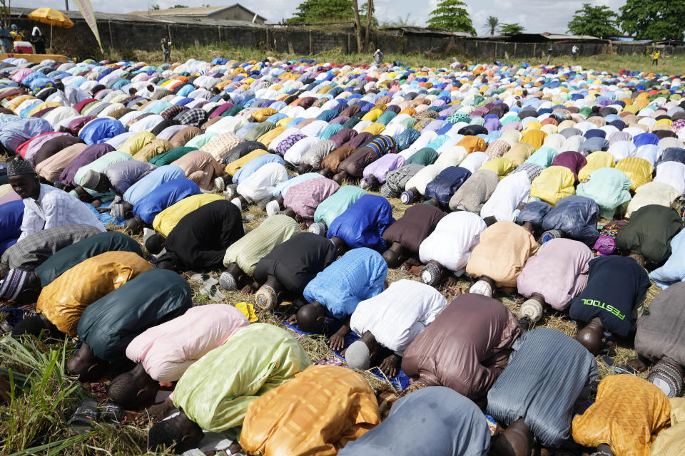 Nigerian Muslims pray in an open ground field during the Eid al-Fitr prayers in Lagos, Nigeria, Friday, April 21, 2023. Muslims around the world celebrate the end of the holy month of Ramadan.(AP Photo/Sunday Alamba)