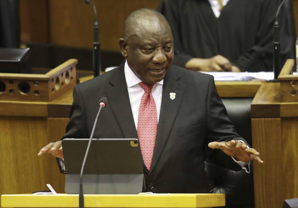 South African President Cyril Ramaphosa delivers his fifth State of the Nation Address to a restricted parliament in Cape Town, South Africa, Thursday, Feb. 11, 2021. Prior to his address Ramaphosa lit a candle for the some 46,000 people who have died from COVID-19 in the country. (Esa Alexander/Pool via AP)