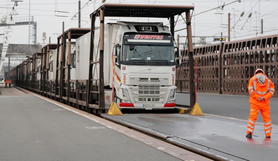 Trucks wait aboard a train bound for Europe, at the Eurotunnel in Folkestone, England, Friday, January 1, 2021. It's the first day after Britain's Brexit split with the European bloc's huge single market for people, goods and services. (AP) Photo/Frank Augstein)