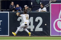 San Diego Padres left fielder Jurickson Profar can't make the catch on a double by Los Angeles Dodgers' Freddie Freeman during the fourth inning of a baseball game, Saturday, May 11, 2024, in San Diego. (AP Photo/Gregory Bull)