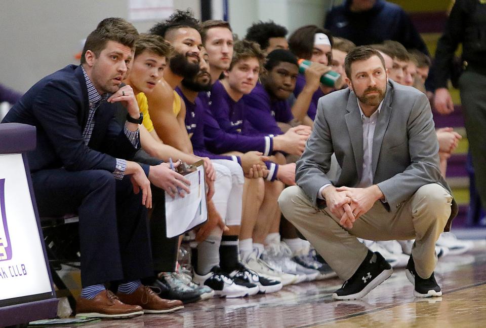 Ashland University's head coach John Ellenwood watches the action from the bench against Tiffin University during NCCA college men’s basketball action Saturday, Feb. 5, 2022 at Kates Gymnasium. AU won 68-59 in overtime. TOM E. PUSKAR/TIMES-GAZETTE.COM