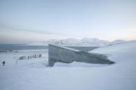 FILE PHOTO: Television crews stand outside the Global Seed Vault before the opening ceremony in Longyearbyen, in the Arctic