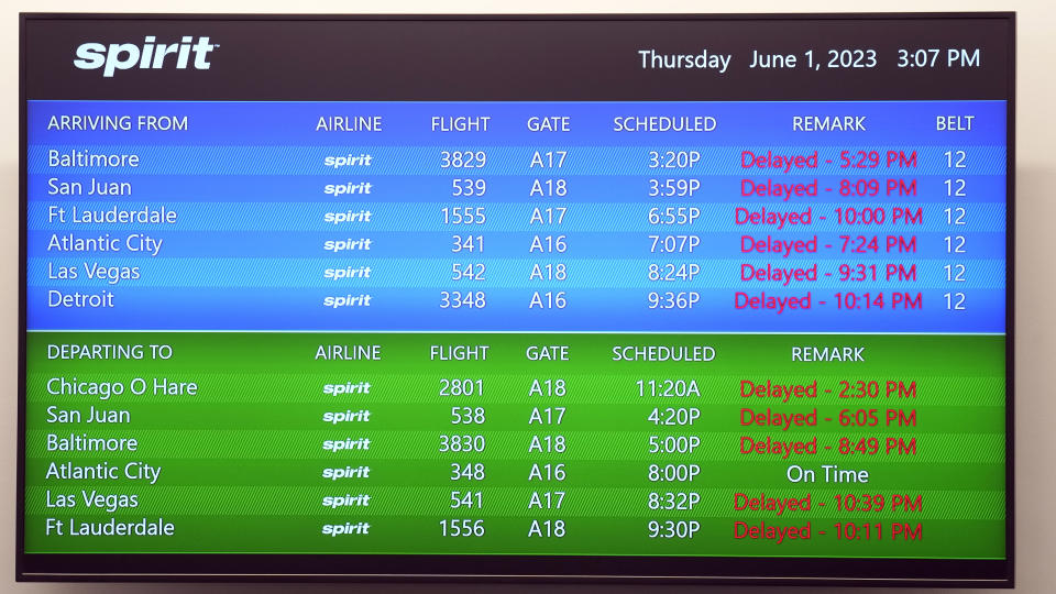 A list of departing and arriving Spirit Airlines flights are shown as delayed at the ticket counter at Tampa International Airport Thursday, June 1, 2023, in Tampa, Fla. Spirit Airlines and Air Canada have delays due to technical problems. (AP Photo/Chris O'Meara)