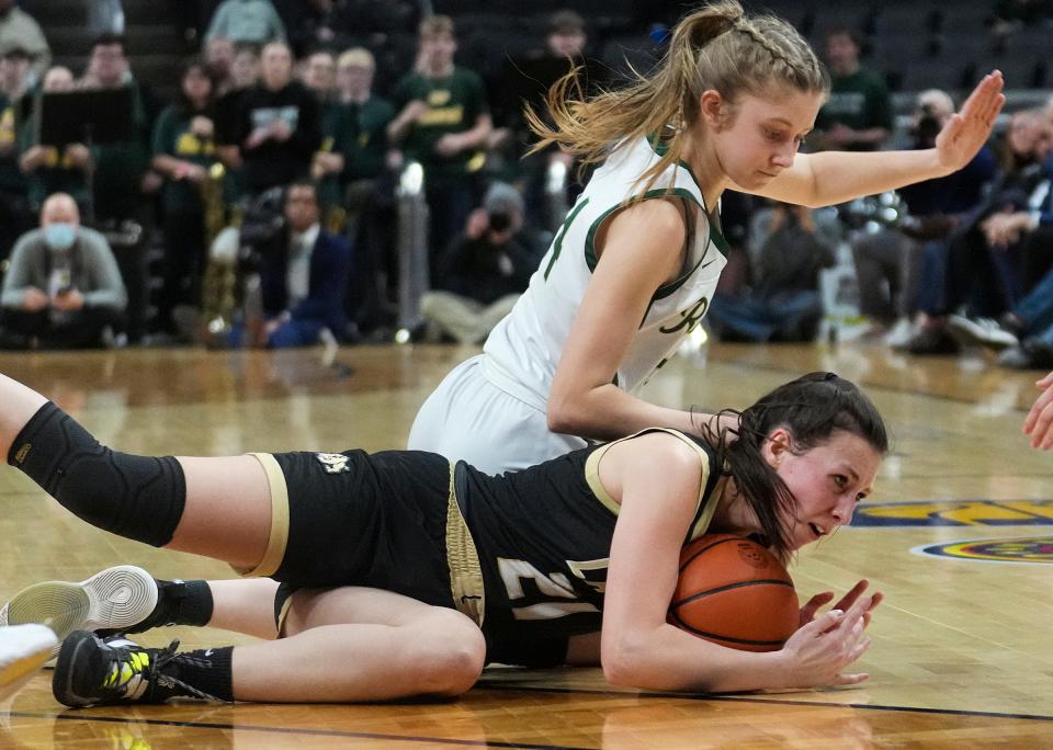 Forest Park Ranger Katlyn Betz (24) and Lapel Bulldog Madelyn Poynter (21) dive after the ball Saturday, Feb. 25, 2023, during the IHSAA Class 2A championship game at Gainbridge Fieldhouse in Indianapolis. Forest Park defeated Lapel for the title, 38-37. 