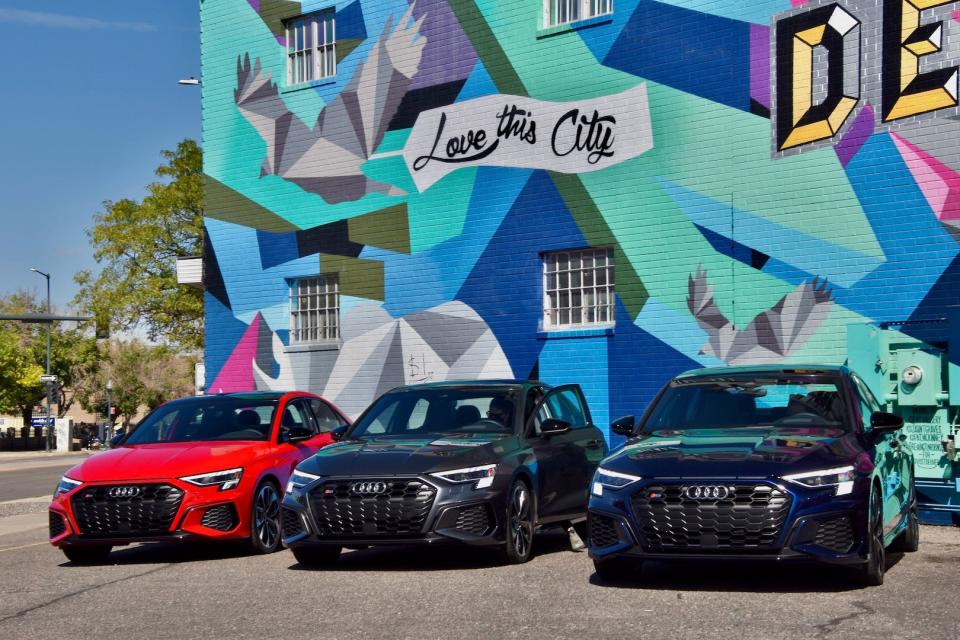 2022 Audi S3s lined up in front of a mural in Denver, CO