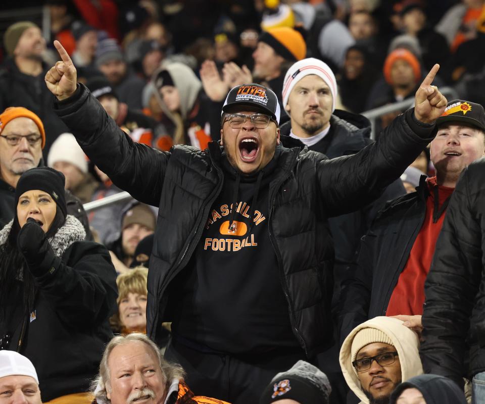 Massillon fans cheer on the Tigers as they defeated Akron Hoban on Thursday night for the Division II state championship at Tom Benson Hall of Fame Stadium in Canton.