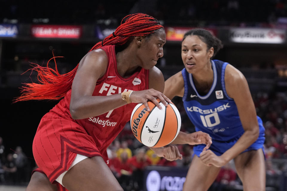 Indiana Fever's Aliyah Boston (7) goes to the basket against Connecticut Sun's Courtney Williams (10) during the second half of a WNBA basketball game Friday, May 19, 2023, in Indianapolis. (AP Photo/Darron Cummings)