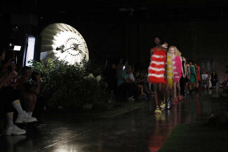 Models wear creations as part of the MSGM women's 2019 Spring-Summer collection, unveiled during the Fashion Week in Milan, Italy, Friday, Sept. 21, 2018. (AP Photo/Antonio Calanni)