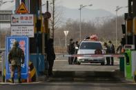 A vehicle leaving the Kaesong joint industrial zone passes through a checkpoint near the Demilitarized Zone separating North and South Korea, in Paju, on February 11, 2016