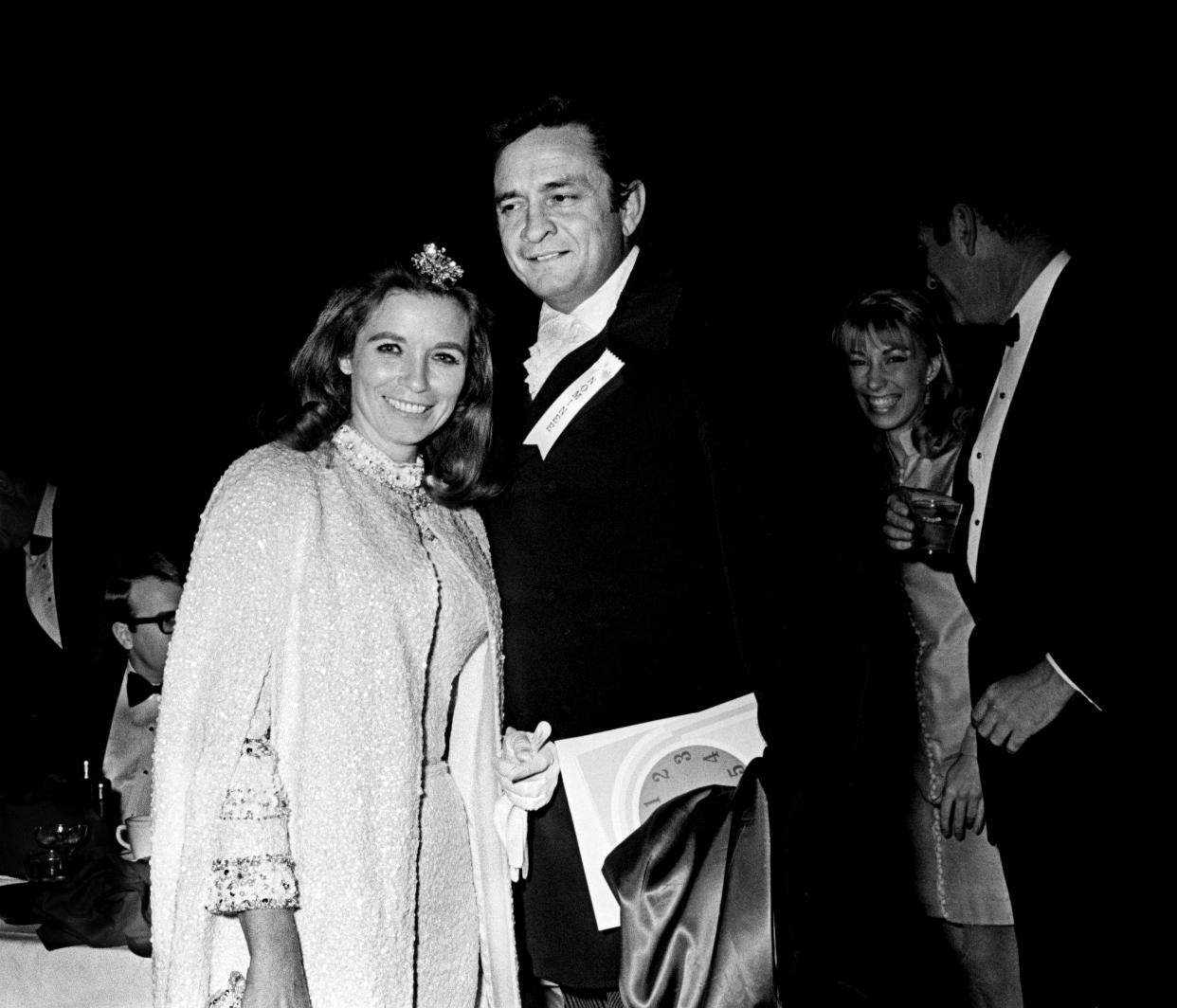 Country music star Johnny Cash and June Carter Cash arrive for the 11th annual Grammy Award show at the National Guard Armory in Nashville March 12, 1969. The awards were presented simultaneously at banquets in New York, Chicago, Los Angeles and Nashville.