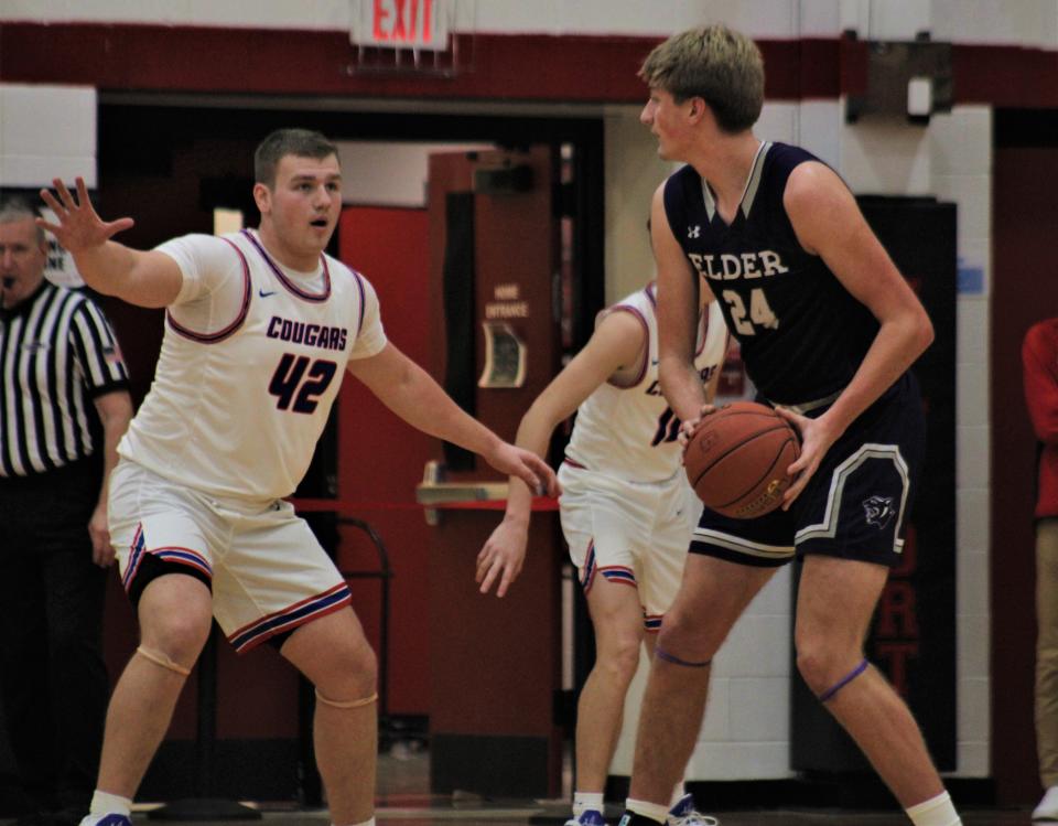 Conner senior Grant Reece guards Elder senior Carson Browne during Elder's 53-42 win over Conner in the John Turner Classic Dec. 10, 2022, at Newport High School.