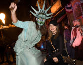 <p>Aren’t you supposed to freak out when you visit Halloween Horror Nights? <i>Good Witch</i> actress Bailee Madison couldn’t help but smile while posing with a purger dressed as the Statue of Liberty. (Photo: Mike Danenberg/Universal Studios Hollywood) </p>