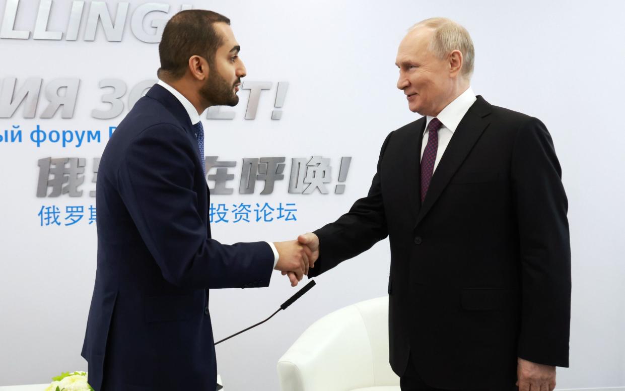 Russian President Vladimir Putin and Omani Minister of Culture, Youth and Sports, Crown Prince Theyazin bin Haitham Al Said