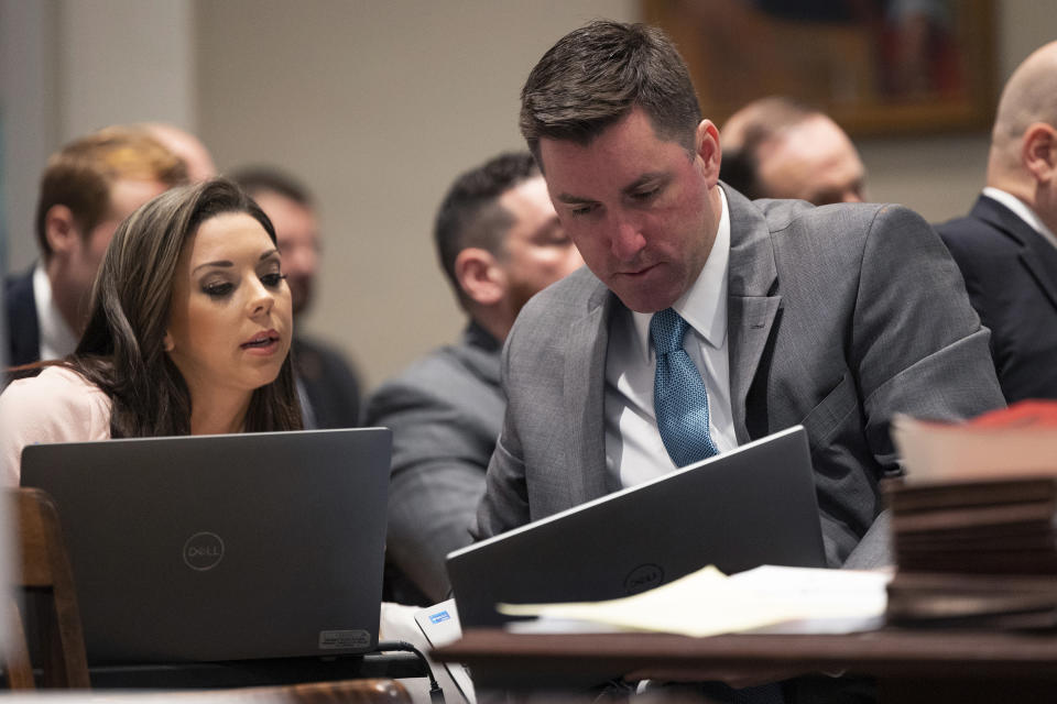 Prosecutor David Fernandez speaks with paralegal Carly Jewell during Alex Murdaugh's trial for murder at the Colleton County Courthouse on Tuesday, Jan. 31, 2023 in Walterboro, S.C. Murdaugh, 54, is standing trial on two counts of murder in the shootings of his 52-year-old wife and 22-year-old son. Murdaugh faces 30 years to life in prison if convicted. (Joshua Boucher/The State via AP, Pool)