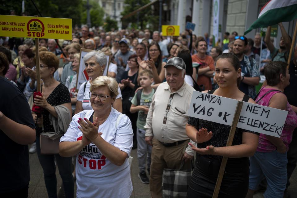 Residents gather in Debrecen, Hungary, during a demonstration against a factory that will produce batteries for electric vehicles on Tuesday, May 23, 2023. Residents, environmentalists and opposition politicians are worried that a sprawling battery factory will exacerbate existing environmental problems and use up the country's precious water supplies. (AP Photo/Denes Erdos)