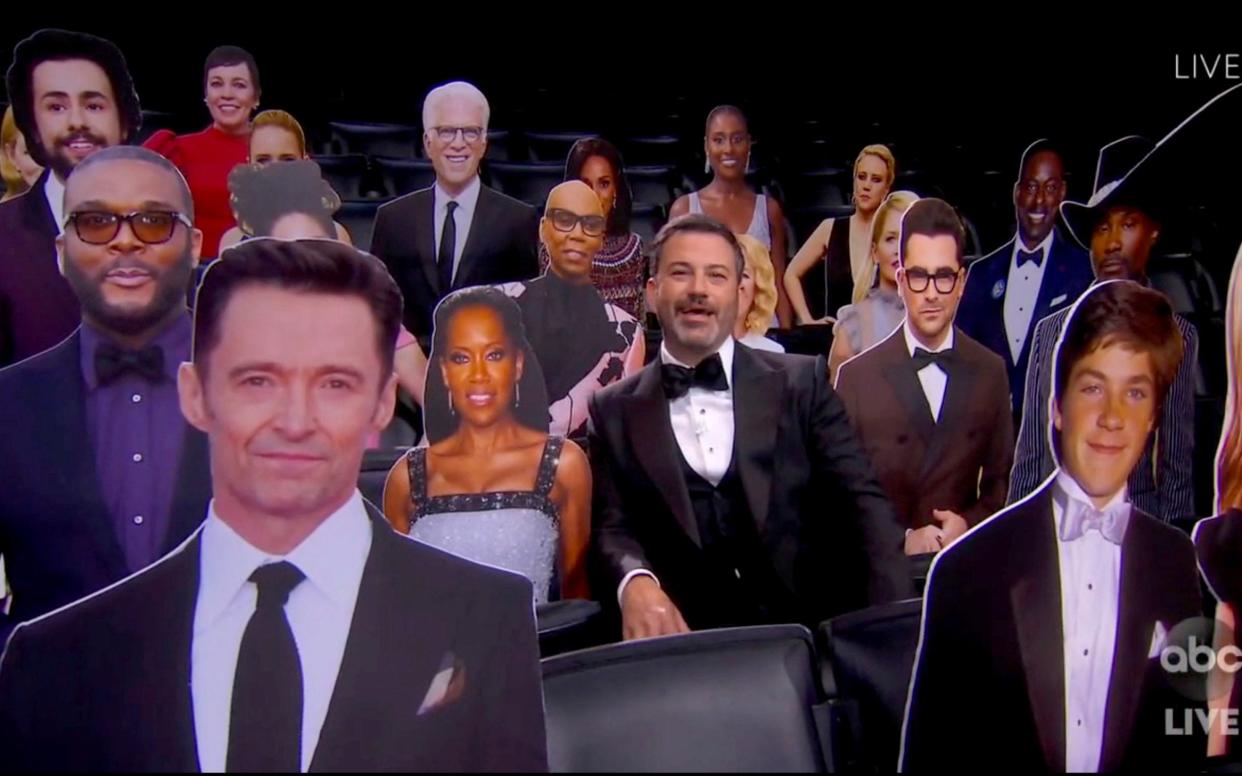 Host Jimmy Kimmel speaks surrounded by cardboard cutouts of actors in the audience during the 72nd Emmy Awards broadcast - The TV Academy and ABC Entertainment